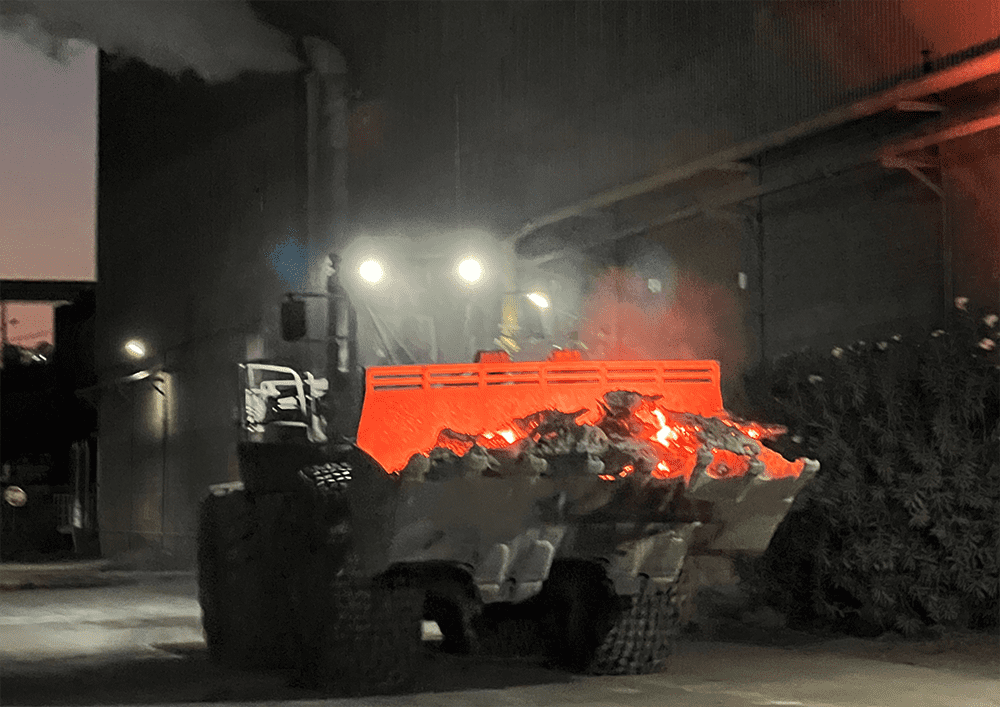 Loader transporting hot slag Loader transporting hot slag