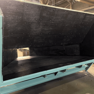 A section of one of the newly manufactured chutes with the liner package installed A section of one of the newly manufactured chutes with the liner package installed